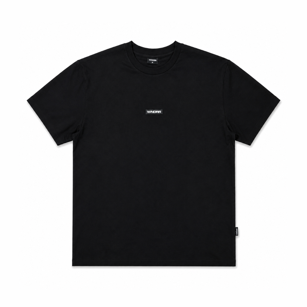 WNDRR Union Box Fit Tee black front view with chest logo patch and crew neck detail